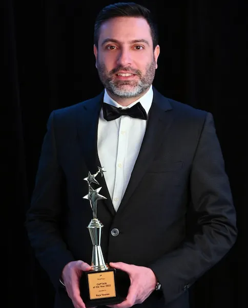 Raja George Younes — Founder of FuturisX, holding Captain of the Year 2022 award